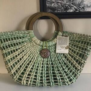 Sun N’ Sand woven green moon shaped basket tote. Wood handles. Natural.